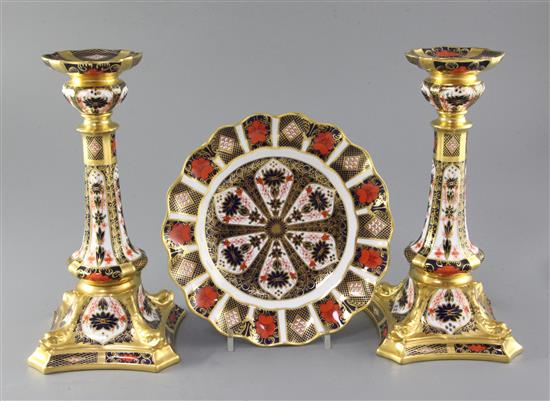 A pair of Royal Crown Derby Old Imari pattern 1128 candlesticks, 21.5cm